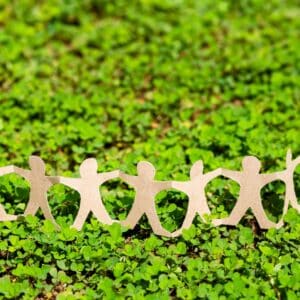 Human chain paper on green creeper plant